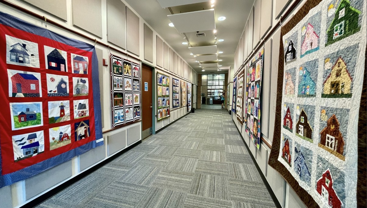 Hallway of the Hilton Head Branch Library covered in quilts